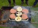 The mushrooms are larger than the burgers.