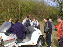 A gaggle of Principles gather around Tina's trike.