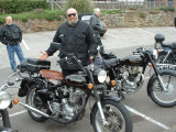 Some strange looking chappie with an equally strange looking bike