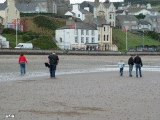 The tide appears to have left somethng on the beach