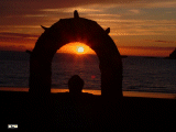 Today we are looking through the arched window - and we find a sunset.